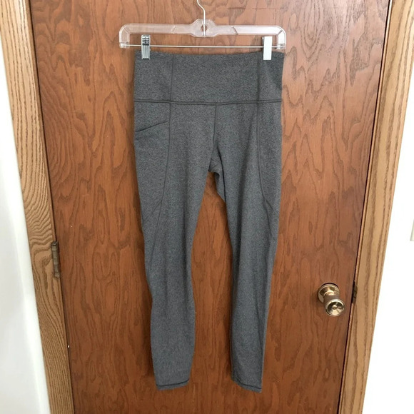 Athleta Pants - Athleta Stash Pocket Salutation Tight Leggings